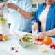 senior couple preparing food for brain health