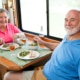 Seniors enjoying a meal after hospital discharge